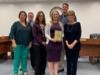 Board members Jill Holcomb and Amanda Riedel were recognized by Kelly Owens for their completion of board certification.